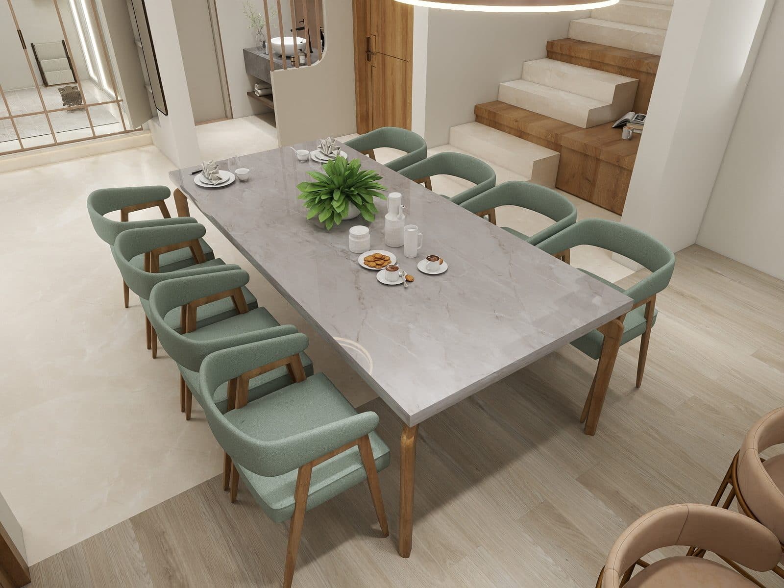 Grey marble dining table with sage bouclé chairs, seen from above with the stair rising beyond