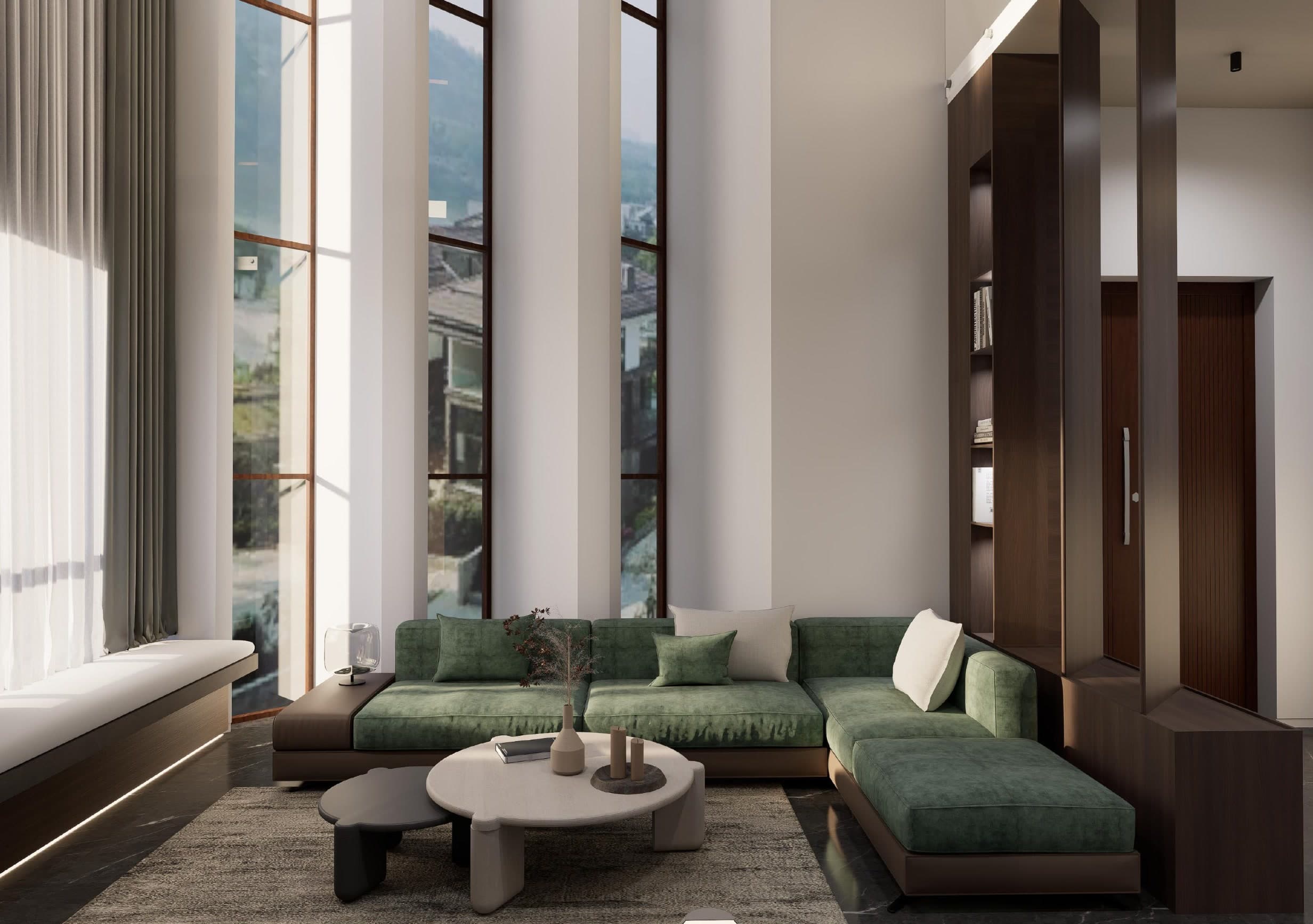 The living room from the opposite side, the green sofa set against a wall of dark timber joinery and a fluted timber door