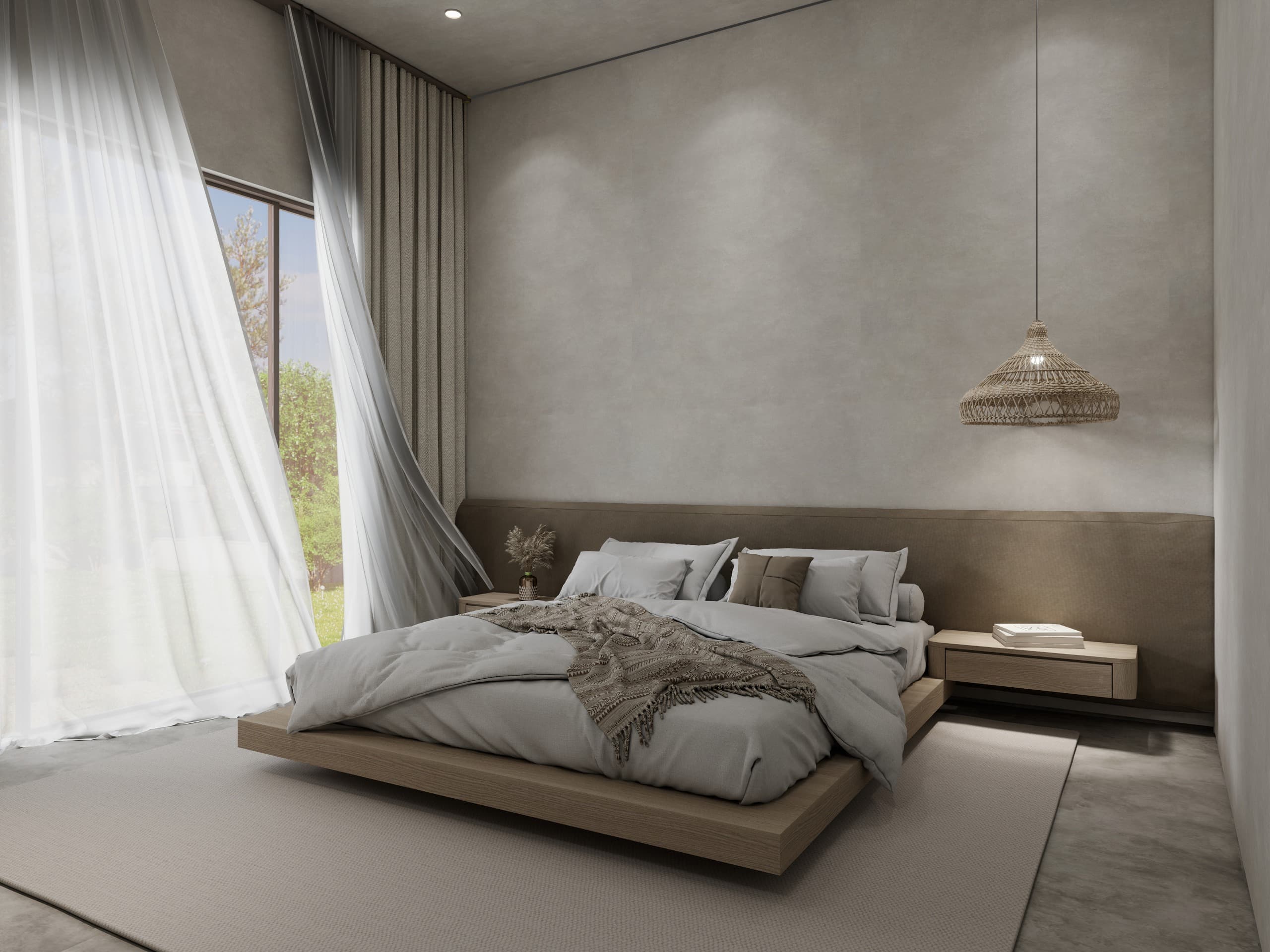 The same bedroom from the window side, the platform bed on a pale rug against a microcement wall