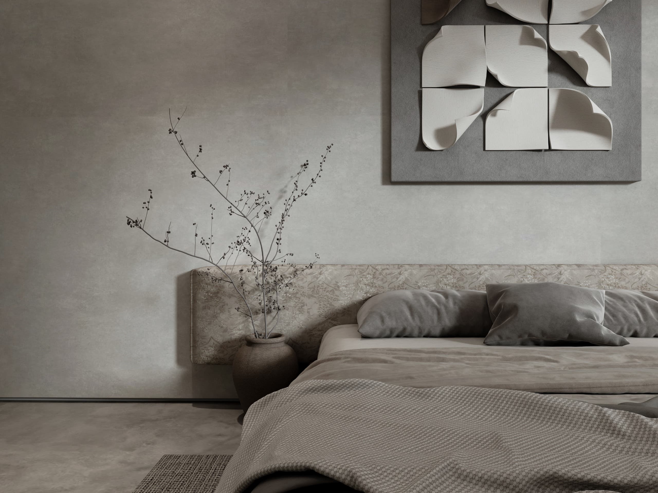 The same headboard wall seen close, the plaster relief above a stoneware vase of dried branches