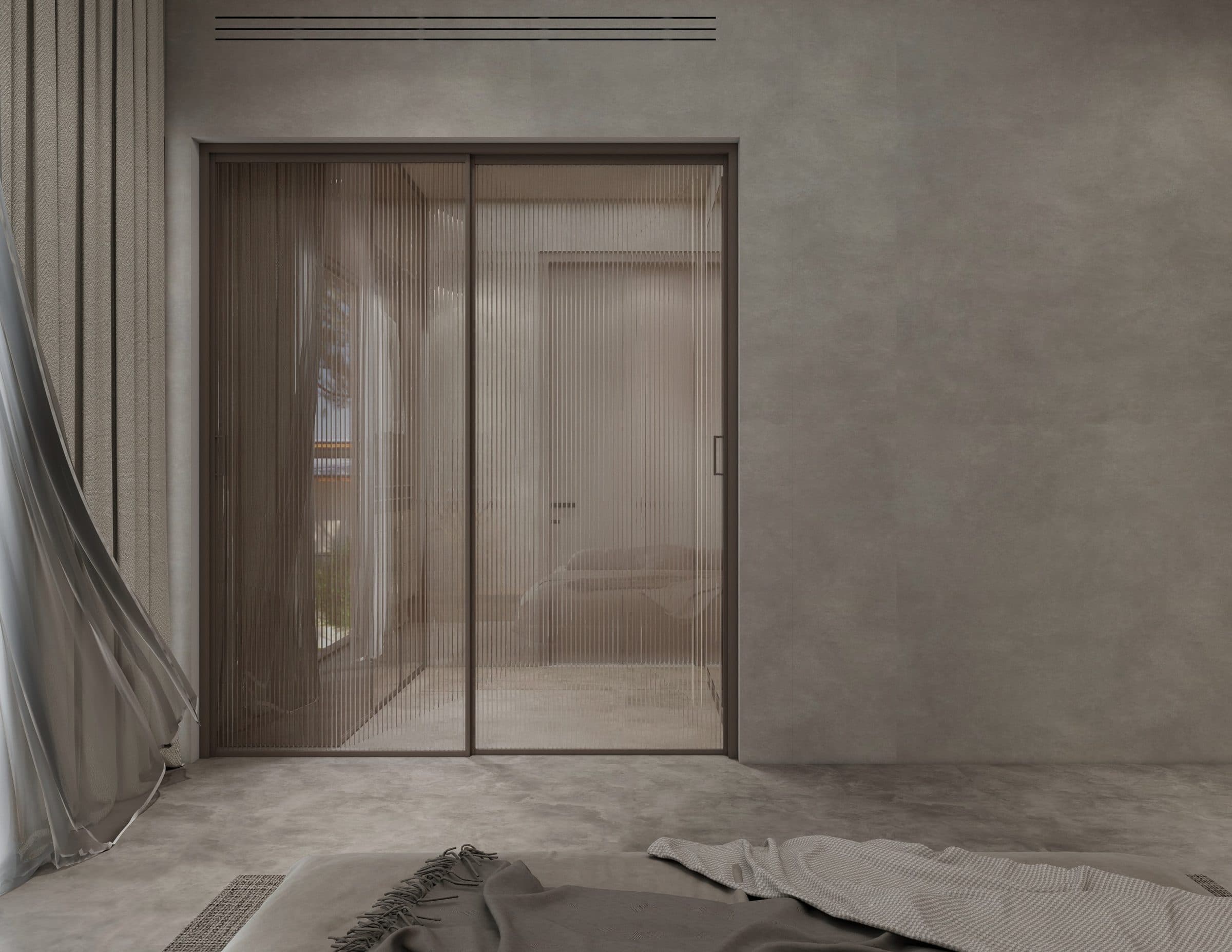 Fluted glass sliding doors leading from the bedroom through to the dressing area