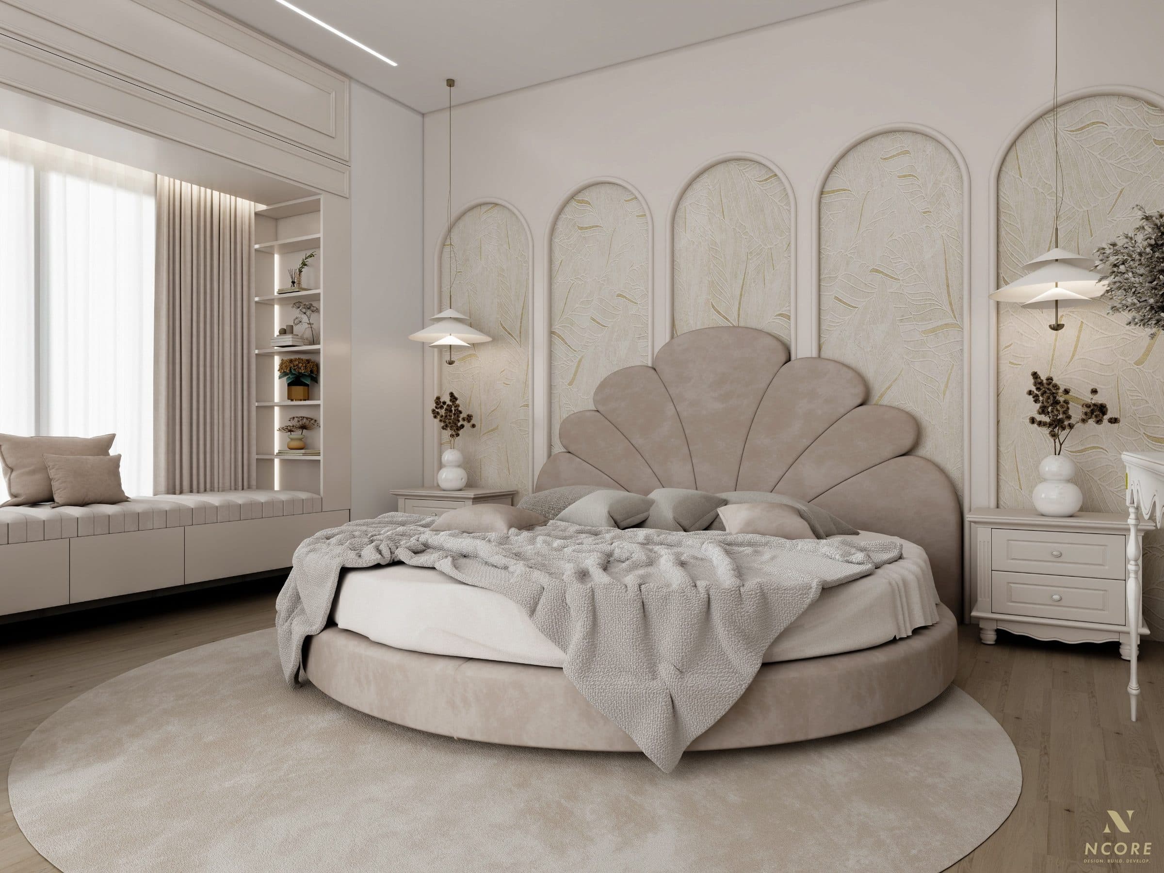 Bedroom with a round bed and scalloped shell headboard set against arched panels of leaf-relief plaster, an upholstered window seat along the far wall