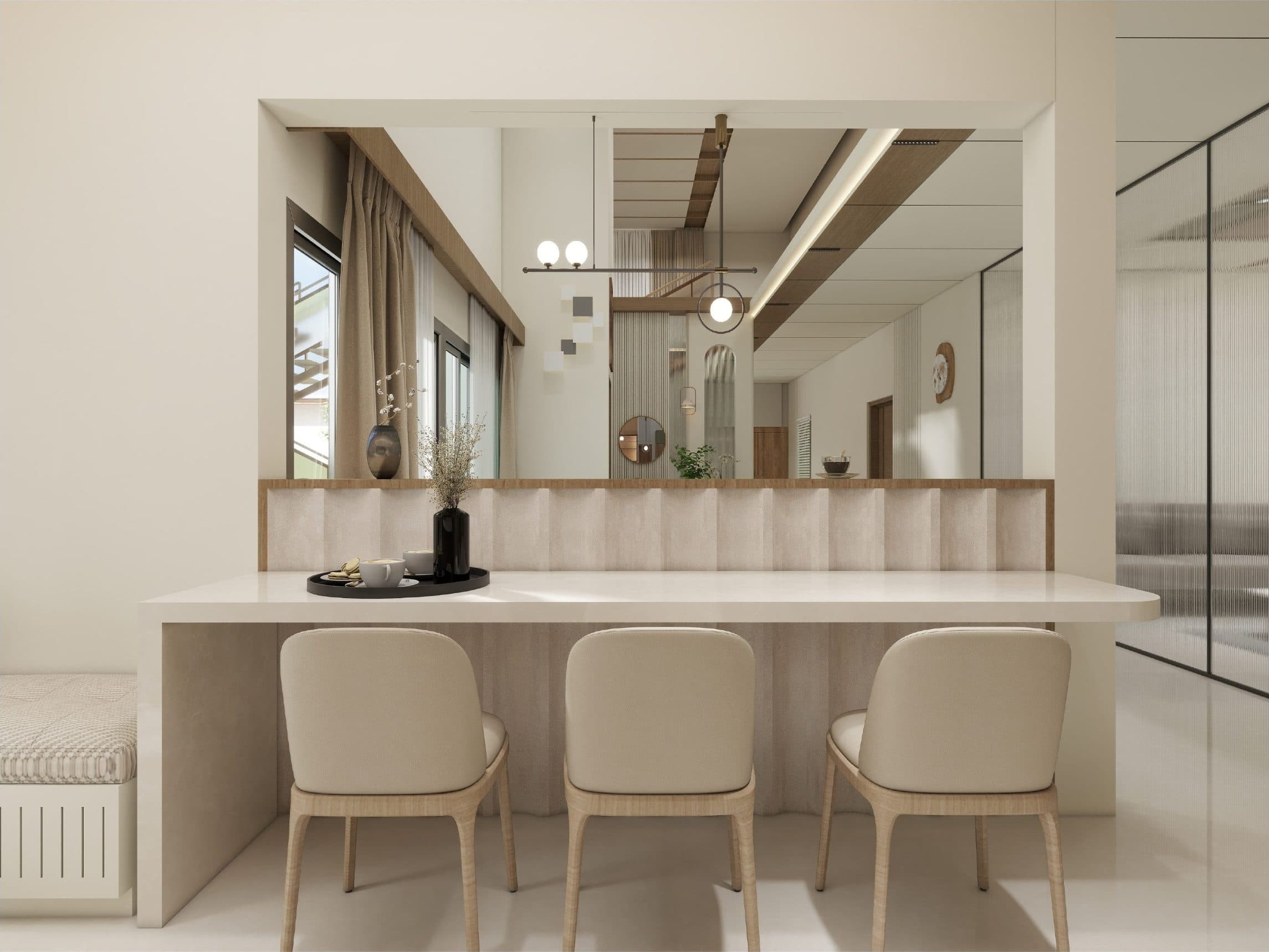 Breakfast counter with a reeded backsplash and a mirrored opening looking back into the double-height hall