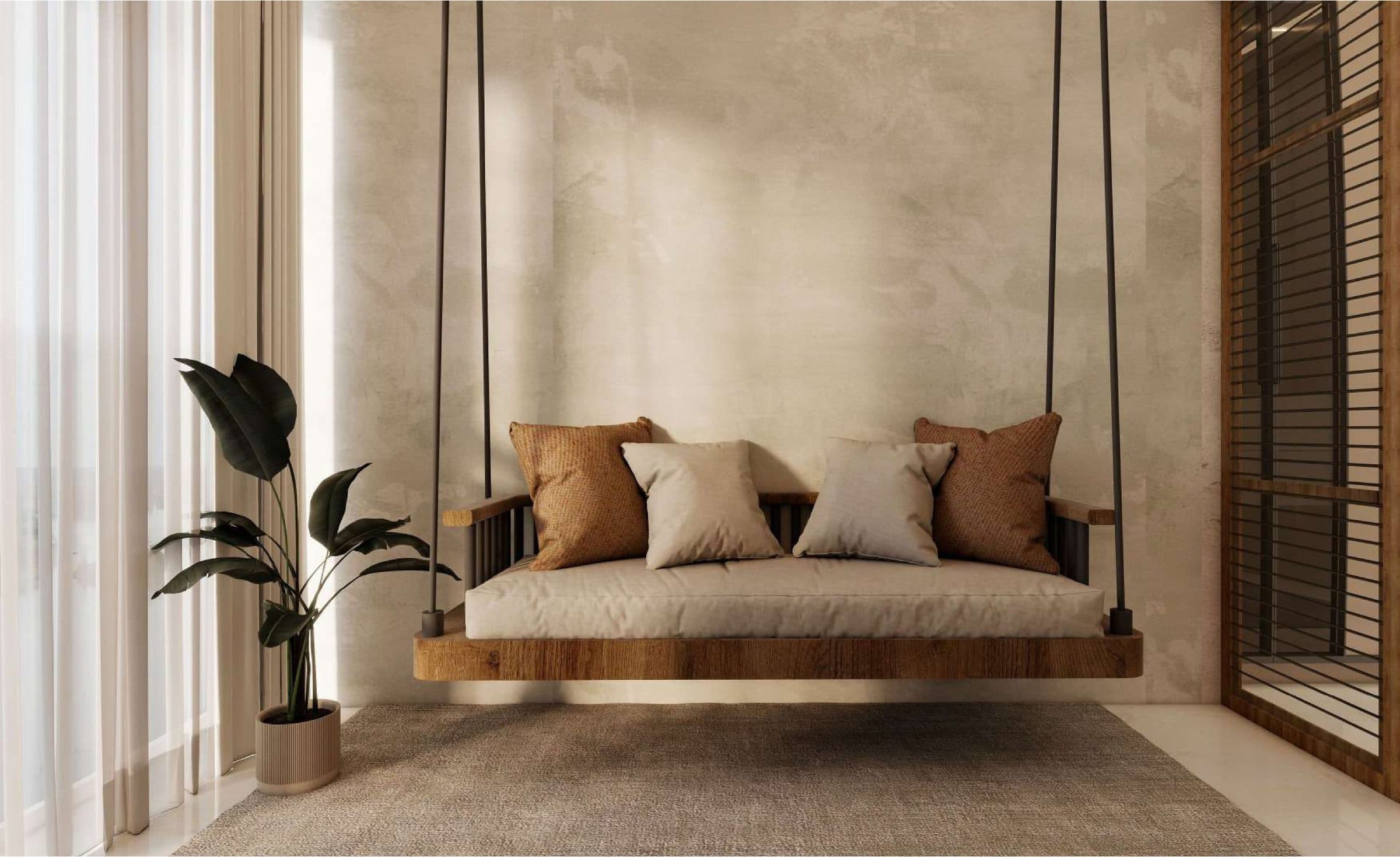 Oak and rope oonjal swing hanging against a bare plaster wall in the light of a tall curtained window