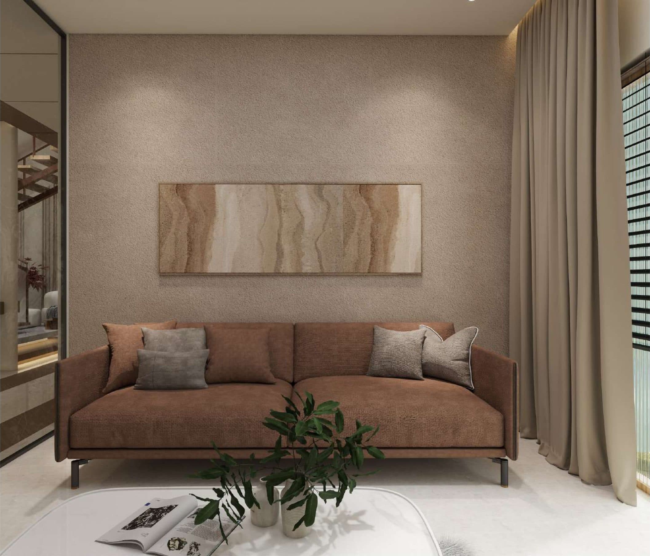 Sitting area with a russet sofa against textured plaster, below a long travertine artwork
