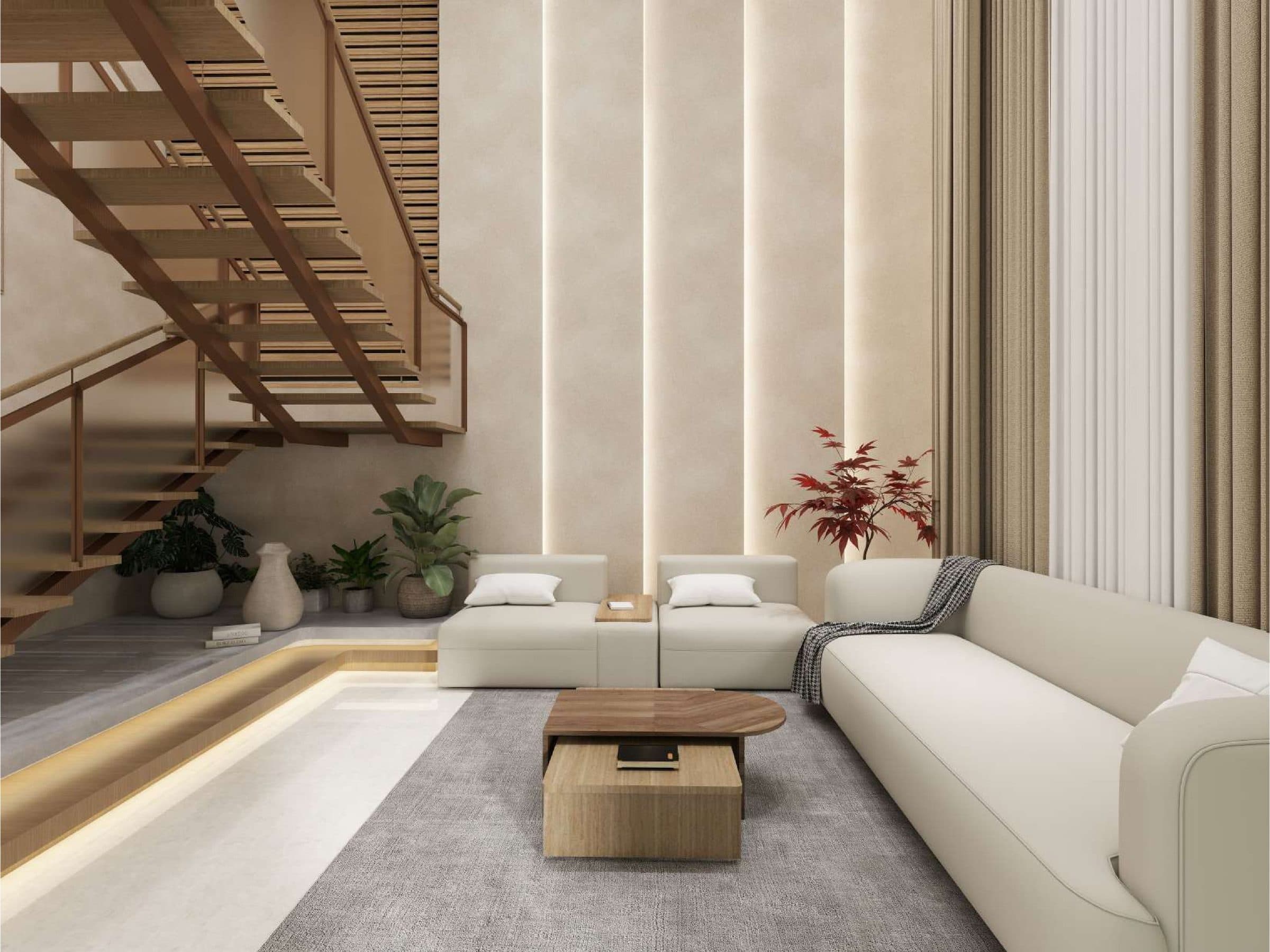 Double-height living hall with modular seating on a lit plinth, beneath the folded timber stair